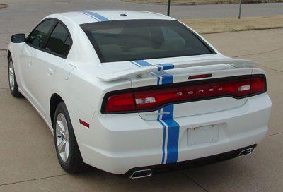 rear view of asymmetrical and different size stripes vertical down a white dodge charger